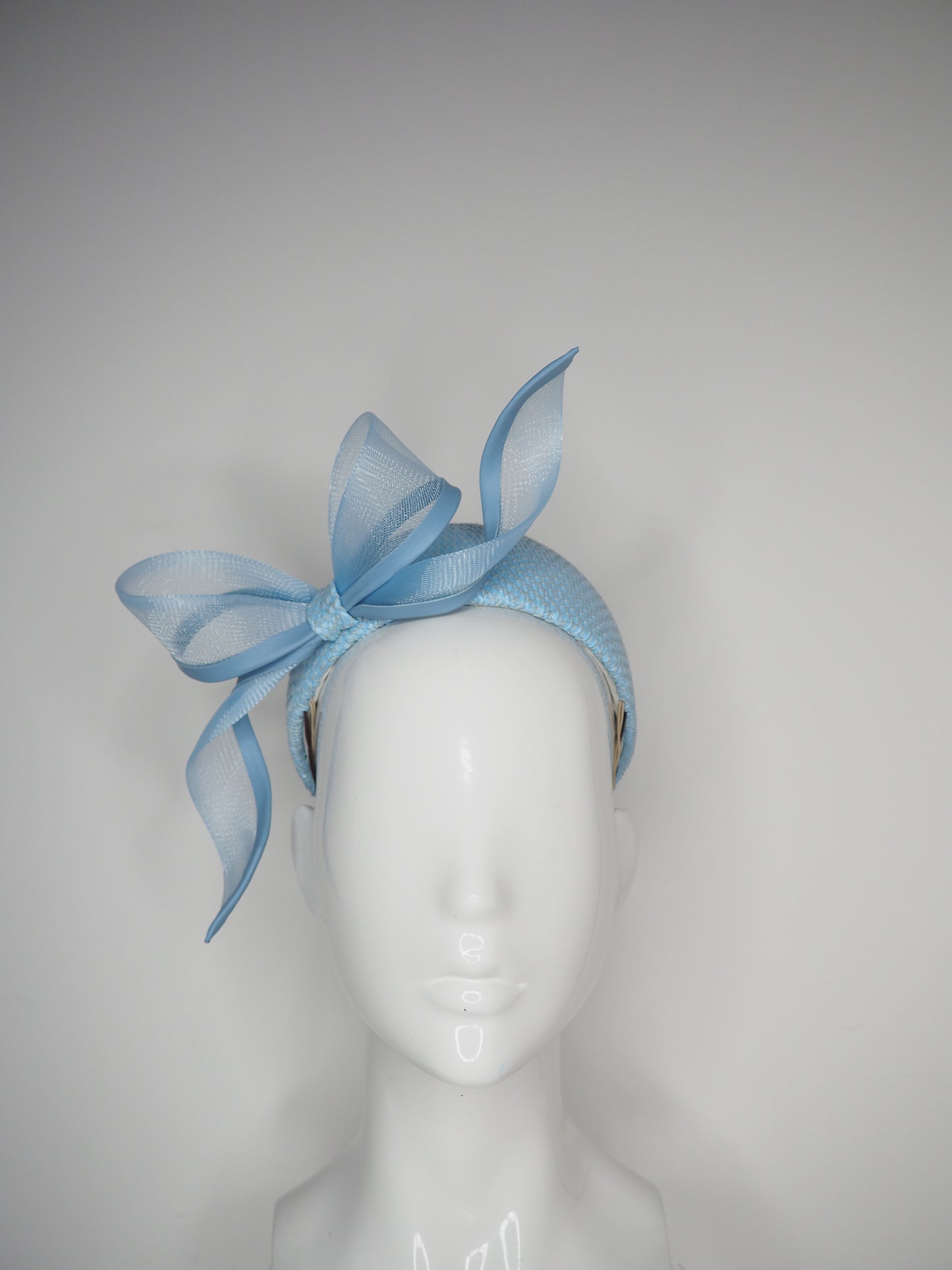 Sky High - Baby Blue Jacki-O style rear facing pillbox featuring a leather edged crinoline bow in baby blue.