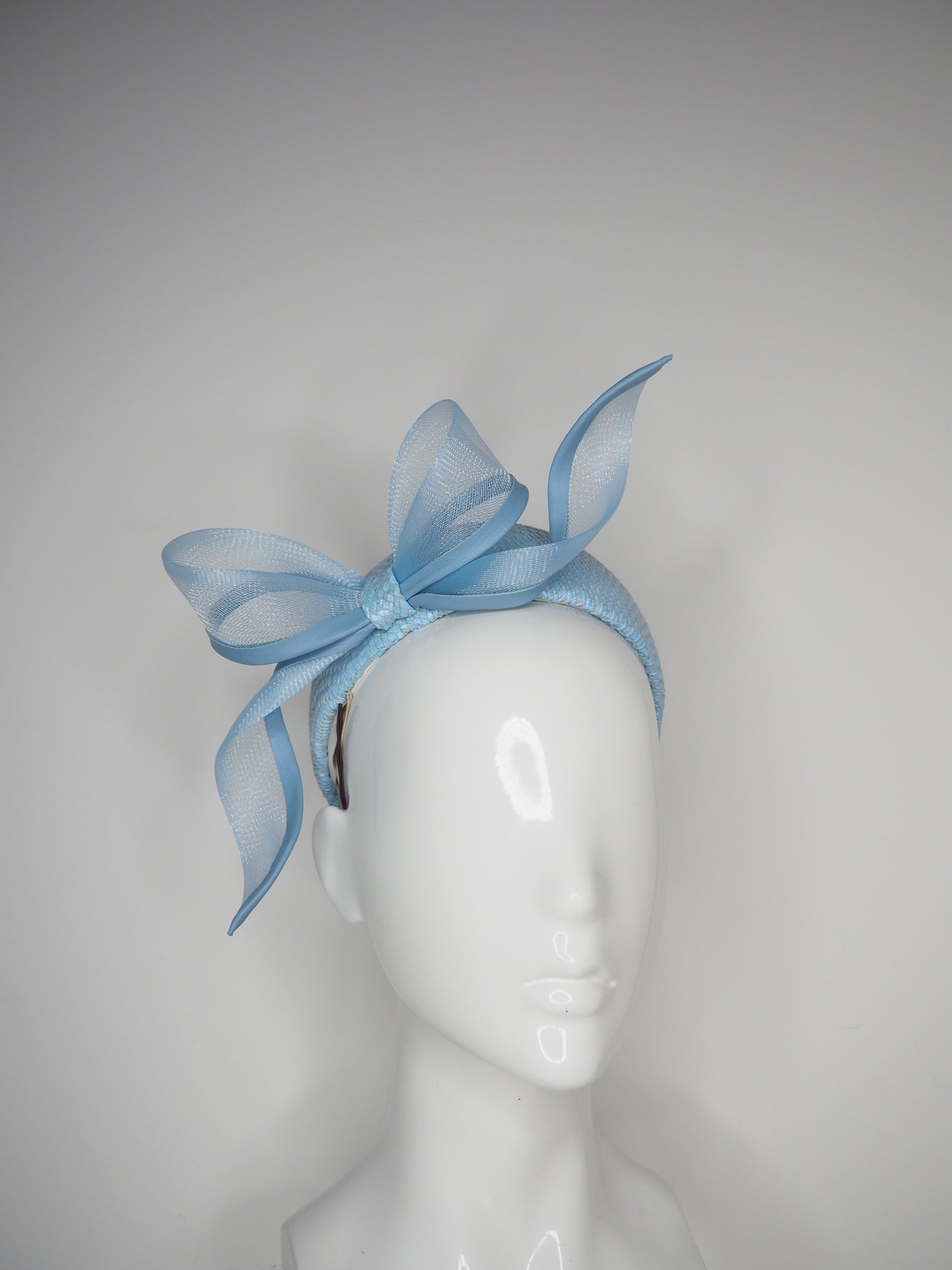 Sky High - Baby Blue Jacki-O style rear facing pillbox featuring a leather edged crinoline bow in baby blue.