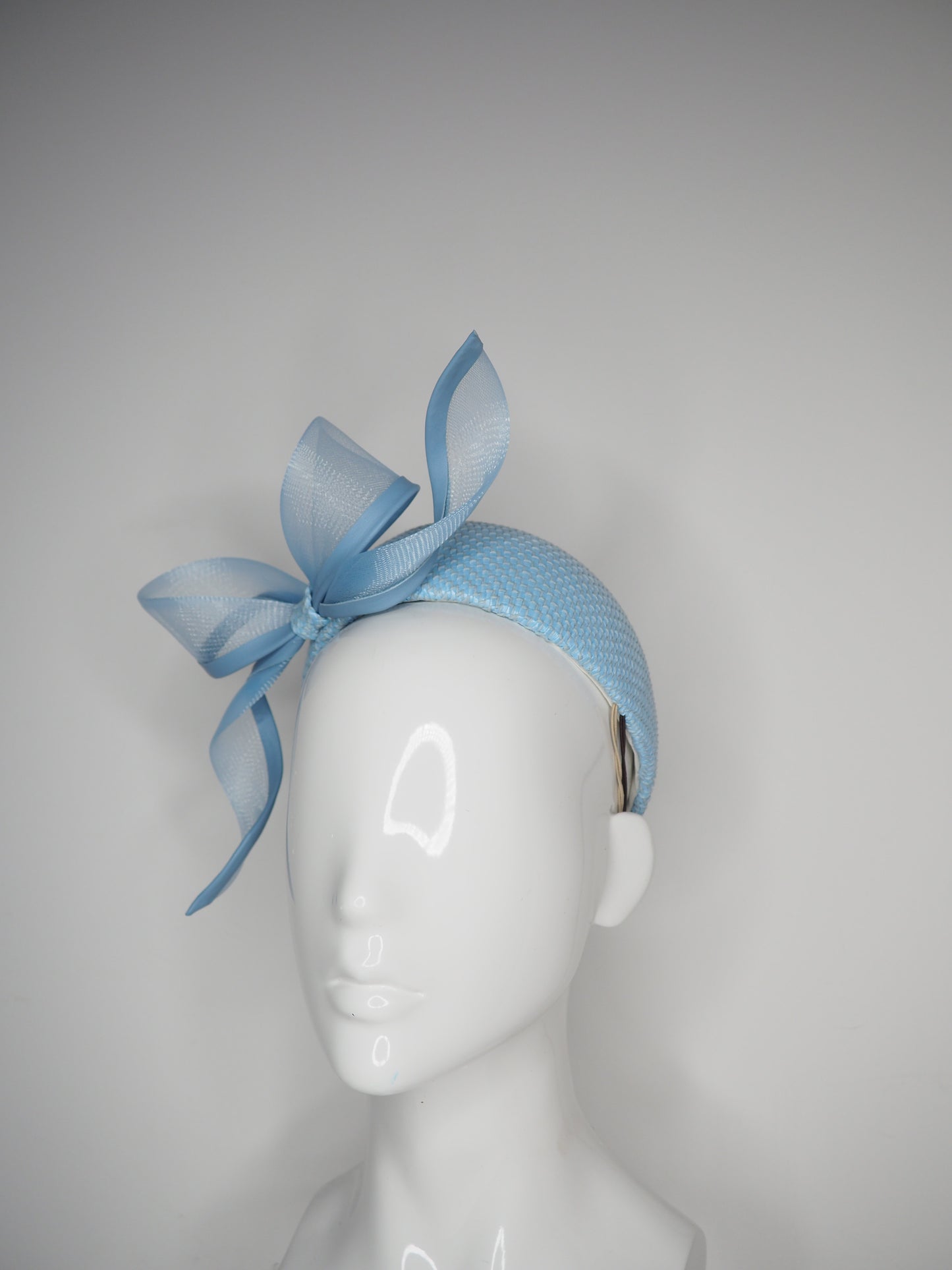 Sky High - Baby Blue Jacki-O style rear facing pillbox featuring a leather edged crinoline bow in baby blue.