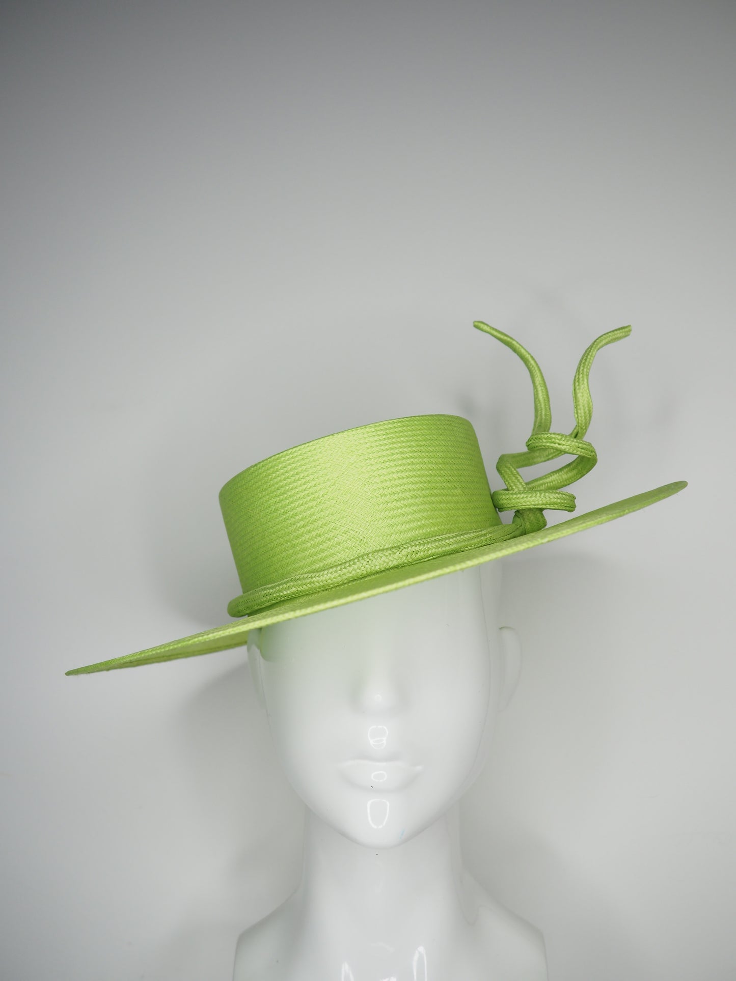 Lime Twist - Hand Dyed lime green straw boater with a sculpted wired parissisal rope knot.