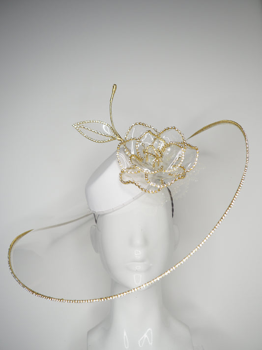 Golden Rose - Transparent peekaboo embellished brim withwhite leather crown and gold crystoform chain rose.